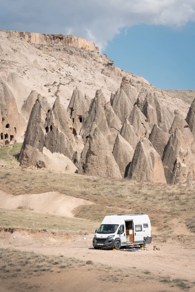 Our van parked beneath the fairy chimneys in Cappadocia